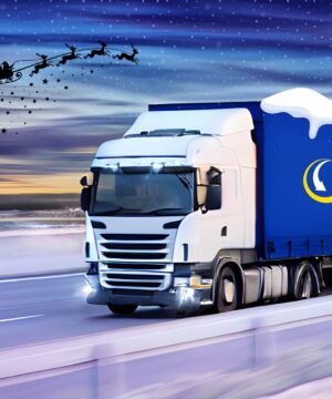 J&B Recycling truck on a motorway with snow and Santa flying overhead