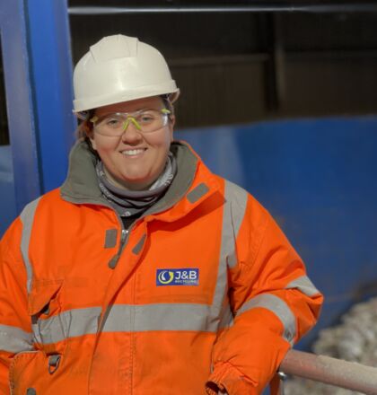 Photo of female operations manager at J&B Recycling wearing PPE and a hard hat