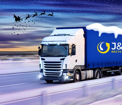 J&B Recycling truck on a motorway with snow and Santa flying overhead