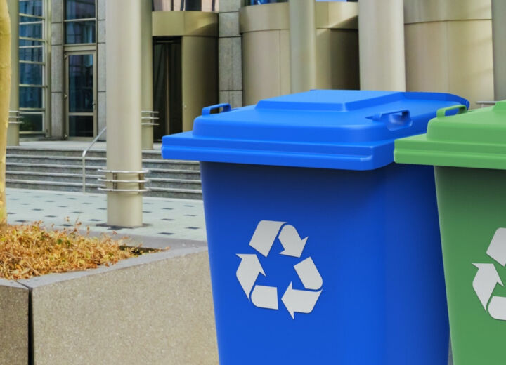 Blue and green wheelie bins for dry mixed recyclables such as cardboard, paper and plastic