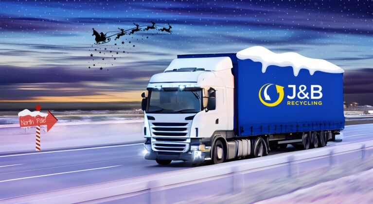 J&B Recycling truck on a motorway with snow and Santa flying overhead