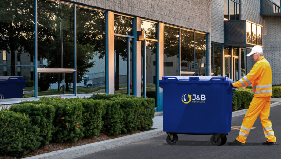 Bin collection, blue wheelie bin being collected by bin man