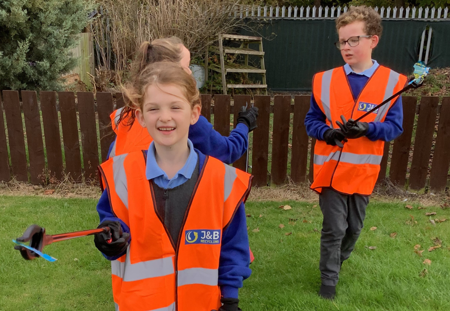 St Bede's children using litter picking kits